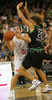 Marko Milic (no.12) of Union Olimpija (L) scoring next to Shaun Stonerook (no.20) of Montepaschi Siena (R) during match of 8th round of Basketball Euroleague between Union Olimpija, Ljubljana, Slovenia and Montepaschi Siena, Italy. Match between KK Union Olimpija and Montepaschi Siena was played in Tivoli Arena in Ljubljana, Slovenia on 13. December 2007.

