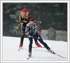 Second placed Olga Pyleva of Russia (front) and third placed Kati Wilhelm of Germany (back) skiing during mass start competition of the Biathlon World Cup in Pokljuka. Biathlon Ruhrgas World Cup was held on Pokljuka, Slovenia between 16. and 20.February 2005. Biathletes were competing on Sunday in 12.5km race with mass start, which was won by Sandrine Bailly of France, Olga Pyleva of Russia placed second while Kati Wilhelm of Germany finished third. <br> 
