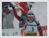 Winner Sandrine Bailly of France celebrating her third consecutive victory in Pokljuka in women mass start race of Biathlon World Cup in Pokljuka, Slovenia. Biathlon Ruhrgas World Cup was held on Pokljuka, Slovenia between 16. and 20.February 2005. Biathletes were competing on Sunday in 12.5km race with mass start, which was won by Sandrine Bailly of France, Olga Pyleva of Russia placed second while Kati Wilhelm of Germany finished third.
