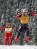 Second placed Raphael Poiree of France (R) and winner Ole Einar Bjoerndalen of Norway (L) skiing during men pursuit race of e.on Ruhrgas IBU Biathlon World cup which was held on Pokljuka, Slovenia on 11.March 2006.
