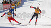 Winner Ole Einar Bjoerndalen of Norway (M), second placed Raphael Poiree of France (R) and third placed Carl Johan Bergman of Sweden (L) sprinting for victory during men pursuit race of e.on Ruhrgas IBU Biathlon World cup which was held on Pokljuka, Slovenia on 11.March 2006.
