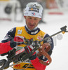 Vincent Defrasne of France getting ready for standing shooting during mixed relay race of IBU Biathlon World Championship which was held on Pokljuka, Slovenia on 12.March 2006. Race was won by relay of Russia, relay of Norway placed second, while relay of France finished third.
