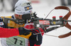 Vincent Defrasne of France shooting during mixed relay race of IBU Biathlon World Championship which was held on Pokljuka, Slovenia on 12.March 2006. Race was won by relay of Russia, relay of Norway placed second, while relay of France finished third.
