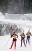 Lucija Larisi of Slovenia followed by Sandrine Bailly of France and Irina Malgina of Russia skiing during mixed relay race of IBU Biathlon World Championship which was held on Pokljuka, Slovenia on 12.March 2006. Race was won by relay of Russia, relay of Norway placed second, while relay of France finished third.
