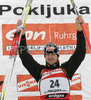 Winner Alexander Wolf of Germany celebrating his medal won in men sprint race on Pokljuka, Slovenia. IBU Biathlon World Cup sprint race was held on Pokljuka, Slovenia on 18th of January 2007.
