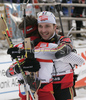 Winner Christoph Sumann of Austria (L) and second placed Alexander Wolf of Germany (R) celebrating their success after they crossed finish line of men pursuit race on Pokljuka, Slovenia. IBU Biathlon World Cup sprint race was held on Pokljuka, Slovenia on 20th of January 2007.
