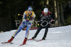 Anna Carin Olofsson of Sweden (L) and  <br> Florence Baverel-Robert of France  (R) skiing in women mass start race on Pokljuka, Slovenia. IBU Biathlon World Cup sprint race was held on Pokljuka, Slovenia on 21th of January 2007.

