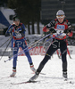Sandrine Bailly of France (R) and Kaisa Mäkäräinen of Finland (L) leaving shooting place after third shooting in women mass start race on Pokljuka, Slovenia. IBU Biathlon World Cup sprint race was held on Pokljuka, Slovenia on 21th of January 2007.
