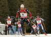 Raphael Poiree of France being followed by Simon Fourcade of France, Dmitri Iarochenko of Russia and Christian De Lorenzi of Italy after second shooting in men mass start race on Pokljuka, Slovenia. IBU Biathlon World Cup sprint race was held on Pokljuka, Slovenia on 21th of January 2007.

