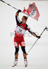 Winner Christoph Sumann of Austria crossing finish line and celebrating his victory in men mass start race on Pokljuka, Slovenia. IBU Biathlon World Cup sprint race was held on Pokljuka, Slovenia on 21th of January 2007.
