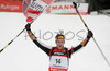 Winner Christoph Sumann of Austria crossing finish line and celebrating his victory in men mass start race on Pokljuka, Slovenia. IBU Biathlon World Cup sprint race was held on Pokljuka, Slovenia on 21th of January 2007.
