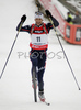 Second placed Vincent Defrasne of France crossing finish line and celebrating his second place in men mass start race on Pokljuka, Slovenia. IBU Biathlon World Cup sprint race was held on Pokljuka, Slovenia on 21th of January 2007.

