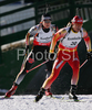 Andreas Birnbacher of Germany following Ye Tian of China in men individual race of e.on Ruhrgas IBU Biathlon World Cup. Men individual race of e.on Ruhrgas IBU Biathlon World Cup was held in Pokljuka, Slovenia, on 13th of December 2007.
