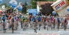 Peloton arriving at finish line in Gemona del Fruili after finishing 18th stage of Giro d Italia. Stage from Sillian, Austria to Gemona del Friuli, Italy was 207 km long. <br> 
