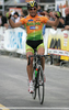 Winner elite category Valter Bonca of Sava Kranj is crossing finish line and celebrating his victory in criterium road cycling race Around city of Kranj 2006 which was held in Kranj, Slovenia on 4th of June 2006.
