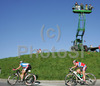 Martina Ruzickova of Czech (L) and Linn Torp of Norway (R) riding by spectators who put up platform on crane to get better view of Women Elite road races of Road Cycling World Championship in Salzburg, Austria. Women Elite road race of Road Cycling World Championship 2006 was held in Salzburg, Austria on 23. September 2006.
