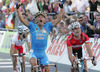 Paolo Bettini of Italy (L) is celebrating his victory on finish line when outsprinting Erik Zabel of Germany (R) and Alejandro Valverde Belmonte of Spain (back)  in Men Elite road races of Road Cycling World Championship in Salzburg, Austria. Men Elite road race was final race of Road Cycling World Championship 2006 and was held in Salzburg, Austria on 24. September 2006.
