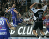 Renato Vugrinec of Portland San Antonio (L) scoring while Sergej Sokolov of RK Gold Club (R) is trying to block during 1/8 finals handball match of EHF Champions League between RK Gold club Hrpelje, Slovenia and Portland San Antonio, Spain. Match was held in Bonifika hall in Koper, Slovenia on 3rd of December 2006. First 1/8 finals match was won by Portland San Antonion with 23:34.
