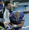 David Carvajal Rodriguez of Portland San Antonio (R) trying to escape Radoslav Stojanovik of RK Gold Club (L) as last men of  RK Gold Club defense  during 1/8 finals handball match of EHF Champions League between RK Gold club Hrpelje, Slovenia and Portland San Antonio, Spain. Match was held in Bonifika hall in Koper, Slovenia on 3rd of December 2006. First 1/8 finals match was won by Portland San Antonion with 23:34.
