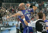 Davor Dominikovic of Portland San Antonio (L)  shooting on goal while Milan Ivanovic of RK Gold Club (R) is trying to block him during 1/8 finals handball match of EHF Champions League between RK Gold club Hrpelje, Slovenia and Portland San Antonio, Spain. Match was held in Bonifika hall in Koper, Slovenia on 3rd of December 2006. First 1/8 finals match was won by Portland San Antonion with 23:34.
