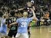 Anja Freser (no.32) of Krim Mercator shooting over Aleksandra Stepanova (no.20) of Dinamo Volgograd (R),  <br> Liudmila Bodnieva (no.14) of Krim Mercator  (M) and Natalia Drygina (no.11) of Dinamo Volgograd (L) during Women Handball Championships League match between Krim Mercator and Dinamo Volgograd. Krim Mercator, Ljubljana, Slovenia was hosting match of 2nd round of Women Handball Championships League against Dinamo Volgograd, Russia in Tivoli Arena on 13th of January 2007. Match was won by Krim Mercator who defeated Dinamo Volgograd 41:33.
