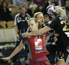 Barbara Varlec (no.51) of Krim (L) shooting while Johanna Ahlm (no.22) of IK Savehof (R) trying to block her during match of 5th round of European Champions handball league. Match between RK Krim, Ljubljana, Slovenia, and IK Savehof, Partille, Sweden was played on 5th of January 2008 in Tivoli Arena in Ljubljana, Slovenia. Match was with draw 24:24.
