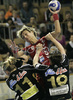 Anja Freser (no.11) of Krim (M) shooting between Cecilia Grubbstrom (no.11) of IK Savehof (L) and Charlotte Brandt (no.19) of IK Savehof during match of 5th round of European Champions handball league. Match between RK Krim, Ljubljana, Slovenia, and IK Savehof, Partille, Sweden was played on 5th of January 2008 in Tivoli Arena in Ljubljana, Slovenia. Match was with draw 24:24.
