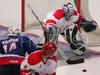 Anze Kopitar of Slovenia (L) trying to score while Denmarks goalie Patrick Galbraith watching the puck during ice hockey match between Slovenia and Denmark on Ice Hockey World Championship Division I, Group A. Denmark won with 3:2, which gives them good chances for winning tournament and qualifying for Elite Division.
