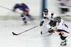 German players attacking with puck during ice hockey match between Slovenia and Germany on Ice Hockey World Championship Division I, Group A. Germany won with 2-0, and Germany also won tournament and is automaticaly qualified for Elite Division. 
