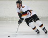 Justin Kruger of Germany with puck during ice hockey match between Slovenia and Germany on Ice Hockey World Championship Division I, Group A. Germany won with 2-0, and Germany also won tournament and is automaticaly qualified for Elite Division. 
