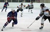 Klemen Zbontar of Slovenia (L) and Justin Kruger of Germany (R) during ice hockey match between Slovenia and Germany on Ice Hockey World Championship Division I, Group A. Germany won with 2-0, and Germany also won tournament and is automaticaly qualified for Elite Division. 
