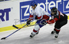 Mike Ellis (no.4) of Great Britain (L) and Tomohiko Uchiyama (no.15) of Japan (R) during first match of IIHF Division 1 World championships between Great Britain and Japan. Match was won by Great Britain who defeated Japan with 4:3. Match was played in Tivoli Arena in Ljubljana, Slovenia on 15th of April 2007.
