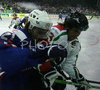 Jaka Avgustincic (no.21) of Slovenia (L) and Balazs Kangyal (no.25) of Hungary (R) going for puck during match of IIHF Division 1 World championships between Slovenia and Hungary. Match was won by Slovenia who defeated Hungary with 4:1. Match was played in Tivoli Arena in Ljubljana, Slovenia on 16th of April 2007.
