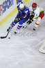 Anze Terlikar (no.24) of Slovenia (L) and Mindaugas Kieras (no.3) of Lithuania (R) during match of IIHF Division 1 World championships between Slovenia and Lithuania. Match was won by Slovenia who defeated Lithuania with 4:2. Match was played in Tivoli Arena in Ljubljana, Slovenia on 21. of April 2007.
