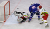 Dejan Varl (no.10) of Slovenia (M) infront of goalie Nerijus Dauksevicius (no.30) of Lithuania (L) while Justinas Vezelis (no.5) of Lithuania (R) is trying ot hinder Varl during match of IIHF Division 1 World championships between Slovenia and Lithuania. Match was won by Slovenia who defeated Lithuania with 4:2. Match was played in Tivoli Arena in Ljubljana, Slovenia on 21. of April 2007.
