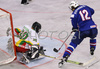David Rodman (no.12) of Slovenia (R) infront of Goalie Nerijus Dauksevicius (no.30) of Lithuania (L) during match of IIHF Division 1 World championships between Slovenia and Lithuania. Match was won by Slovenia who defeated Lithuania with 4:2. Match was played in Tivoli Arena in Ljubljana, Slovenia on 21. of April 2007.
