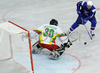 Tomaz Razingar (no.9) of Slovenia (R) infront of goalie Nerijus Dauksevicius (no.30) of Lithuania (L) during match of IIHF Division 1 World championships between Slovenia and Lithuania. Match was won by Slovenia who defeated Lithuania with 4:2. Match was played in Tivoli Arena in Ljubljana, Slovenia on 21. of April 2007.
