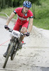 Jernej Muzga of Suunto Slovenica Novice Extreme (U23) competing during 6th race of Slovene cup in cross country MTB race which was held in Kamnik, Slovenia. Due to week long rain track was wet and full of mud which made racing even more demanding. Women elite, women under 23, men juniors and men masters categories had to finish 5 laps long race, while men elite and men under23 had race long 7 laps.
