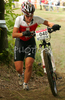 Nathalie Schneitter of Switzerland running uphill in last race of Women cross country (XCO) Nissan UCI Mountain Bike World Cup. Final race of MTB World Cup was held in Maribor, Slovenia, on 15th of September 2007.
