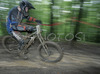 Matjaz Starina of MTB Trbovlje riding during final run of Slovene Cup race in MTB Downhill Kamnik 2006, which was held in Kamnik, Slovenia. Racing was done in extreme conditions caused by heavy rainfall on race day which turned downhill track into mud bath for riders and spectators.
