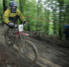 Jure Menard of KD Sloga 1902 Idrija riding during final run of Slovene Cup race in MTB Downhill Kamnik 2006, which was held in Kamnik, Slovenia. Racing was done in extreme conditions caused by heavy rainfall on race day which turned downhill track into mud bath for riders and spectators.
