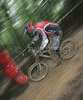 Dusan Leposa of Tropovci Freerider riding during final run of Slovene Cup race in MTB Downhill Kamnik 2006, which was held in Kamnik, Slovenia. Racing was done in extreme conditions caused by heavy rainfall on race day which turned downhill track into mud bath for riders and spectators.
