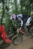 Sebastjan Zmrzljak of MTB Trbovlje Cult riding during final run of Slovene Cup race in MTB Downhill Kamnik 2006, which was held in Kamnik, Slovenia. Racing was done in extreme conditions caused by heavy rainfall on race day which turned downhill track into mud bath for riders and spectators.
