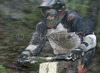 Nejc Rutar of KK Djak Nova Gorica riding during final run of Slovene Cup race in MTB Downhill Kamnik 2006, which was held in Kamnik, Slovenia. Racing was done in extreme conditions caused by heavy rainfall on race day which turned downhill track into mud bath for riders and spectators.
