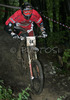 Luka Novak of Suunto Scott riding during final run of Slovene Cup race in MTB Downhill Kamnik 2006, which was held in Kamnik, Slovenia. Racing was done in extreme conditions caused by heavy rainfall on race day which turned downhill track into mud bath for riders and spectators.

