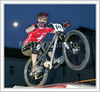 MTB cyclist during WD40 Guerrilla Bikes Night in Skofja Loka. Cyclists had to finish short track with artificial obstacles and jumps when competing against clock and opponent to qualify for next round.

