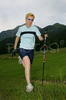 Nordic walker is enjoying her sport on fields near village Preddvor, Slovenia, on nice late spring afternoon. Nordic walking was first used as a summer training method by cross-country skiers. Nordic walking is one of the fastest growing recreational fitness sports in the world. Nordic walking is fitness walking with specially designed nordic walker poles and offers a very efficient, aerobic and easy way to improve your physical condition irrespective of age, sex or physical condition.
