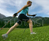 Nordic walker is enjoying her sport on fields near village Preddvor, Slovenia, on nice late spring afternoon. Nordic walking was first used as a summer training method by cross-country skiers. Nordic walking is one of the fastest growing recreational fitness sports in the world. Nordic walking is fitness walking with specially designed nordic walker poles and offers a very efficient, aerobic and easy way to improve your physical condition irrespective of age, sex or physical condition.
