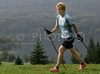 Nordic walker is enjoying her sport on slopes above Bohinj, Slovenia. Nordic walking was first used as a summer training method by cross-country skiers. Nordic walking is one of the fastest growing recreational fitness sports in the world. Nordic walking is fitness walking with specially designed nordic walker poles and offers a very efficient, aerobic and easy way to improve your physical condition irrespective of age, sex or physical condition.
