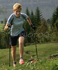 Nordic walker is enjoying her sport on slopes above Bohinj, Slovenia. Nordic walking was first used as a summer training method by cross-country skiers. Nordic walking is one of the fastest growing recreational fitness sports in the world. Nordic walking is fitness walking with specially designed nordic walker poles and offers a very efficient, aerobic and easy way to improve your physical condition irrespective of age, sex or physical condition.
